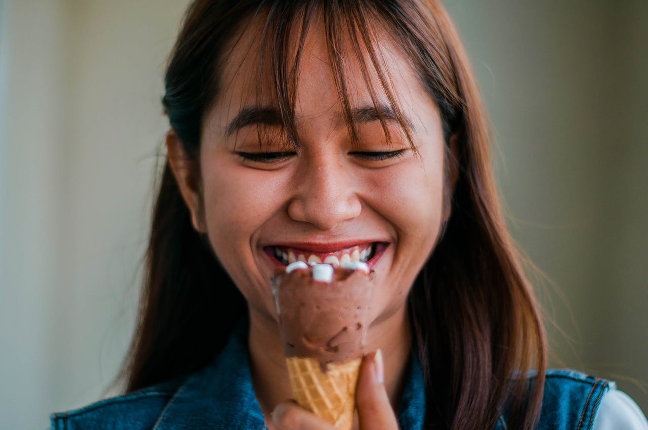 young girl taking ice cream