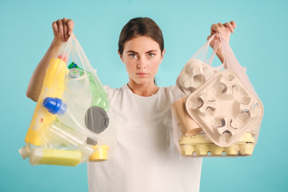girl holding packages sorting plastic