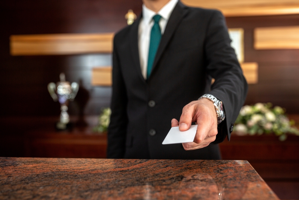 guest holding an hotel key card