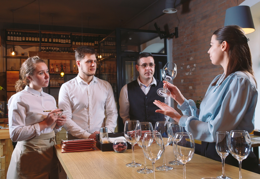 hotel restaurant staff learning to distinguish between glasses