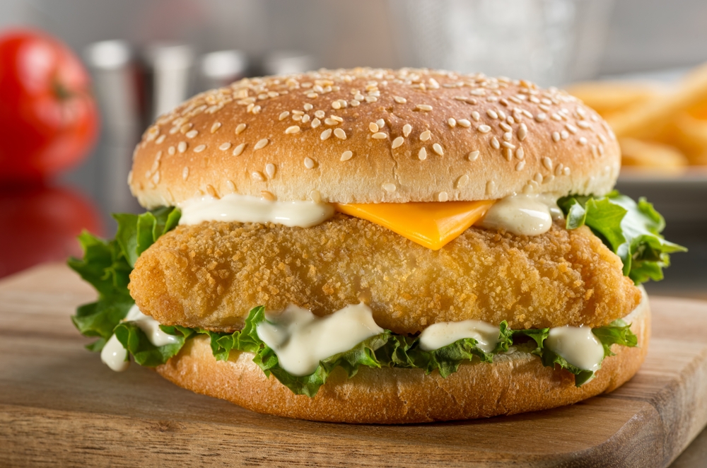 delicious crispy fish burger with cheese and lettuce