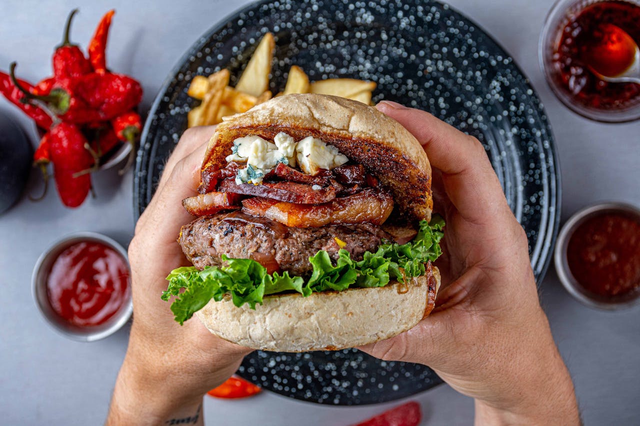 A Person Holding a Hamburger