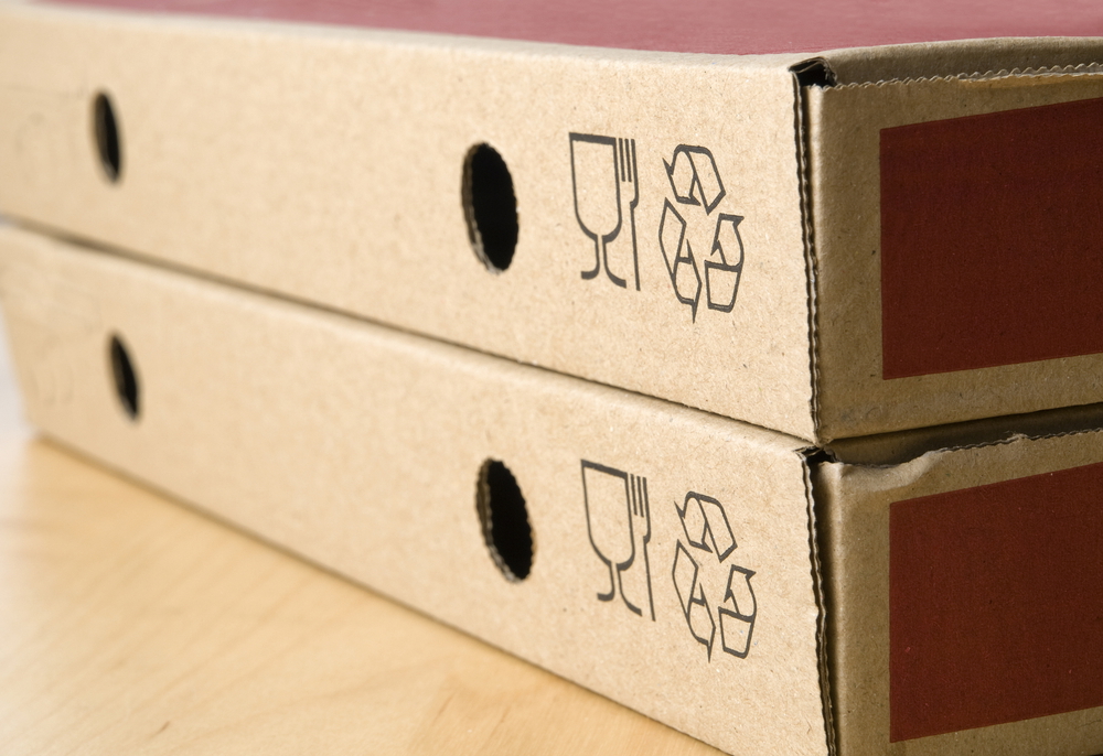 two pizza boxes with recycling symbol