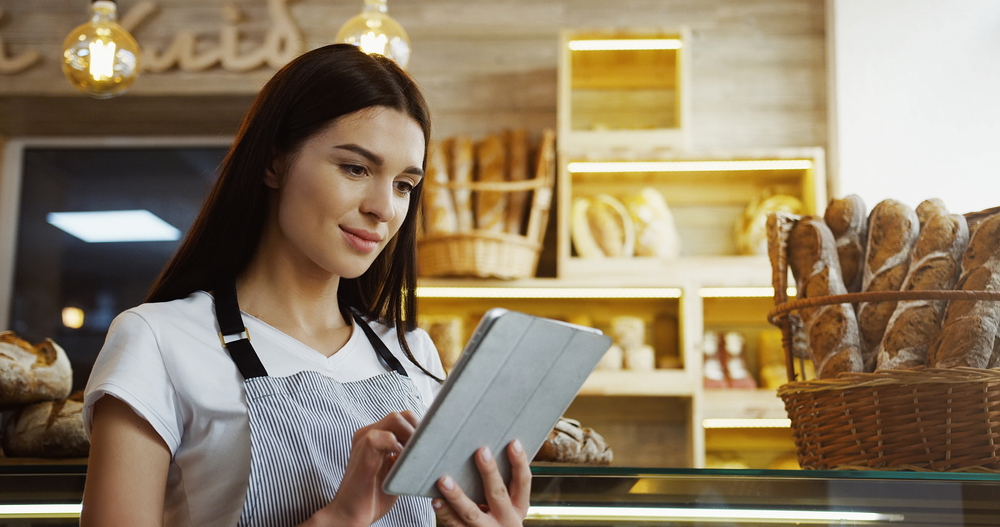 female baker working on her bakery online shop