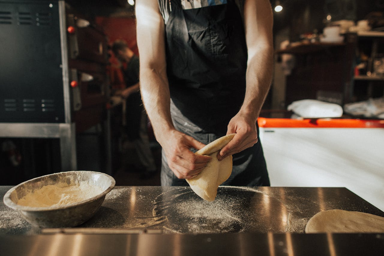 Man Preparing a Pizza Dough