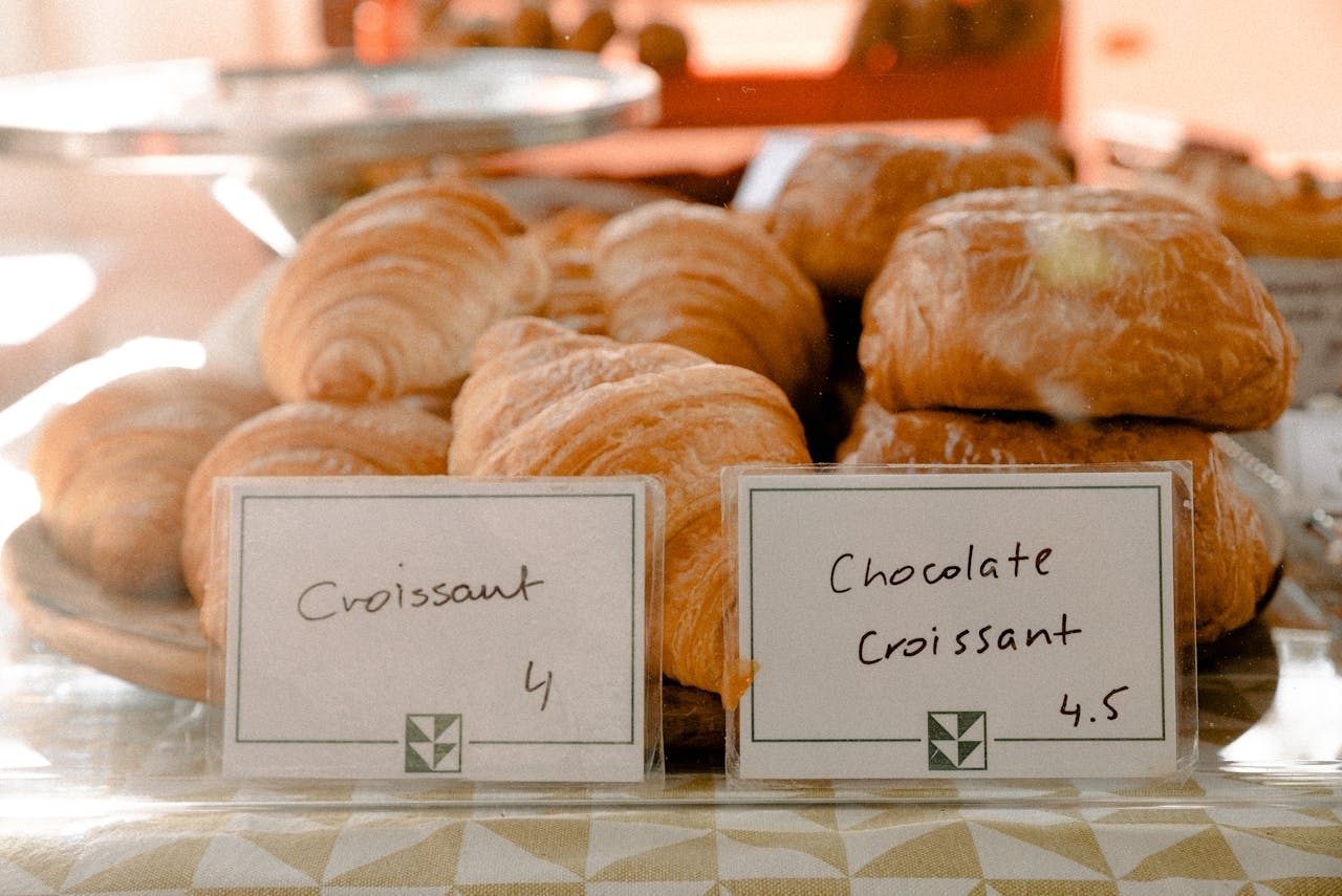 Baked Croissants on Bakery Display