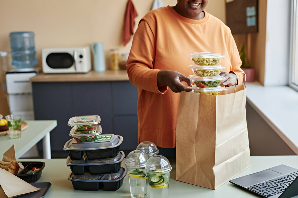 woman unpacking food delivery order