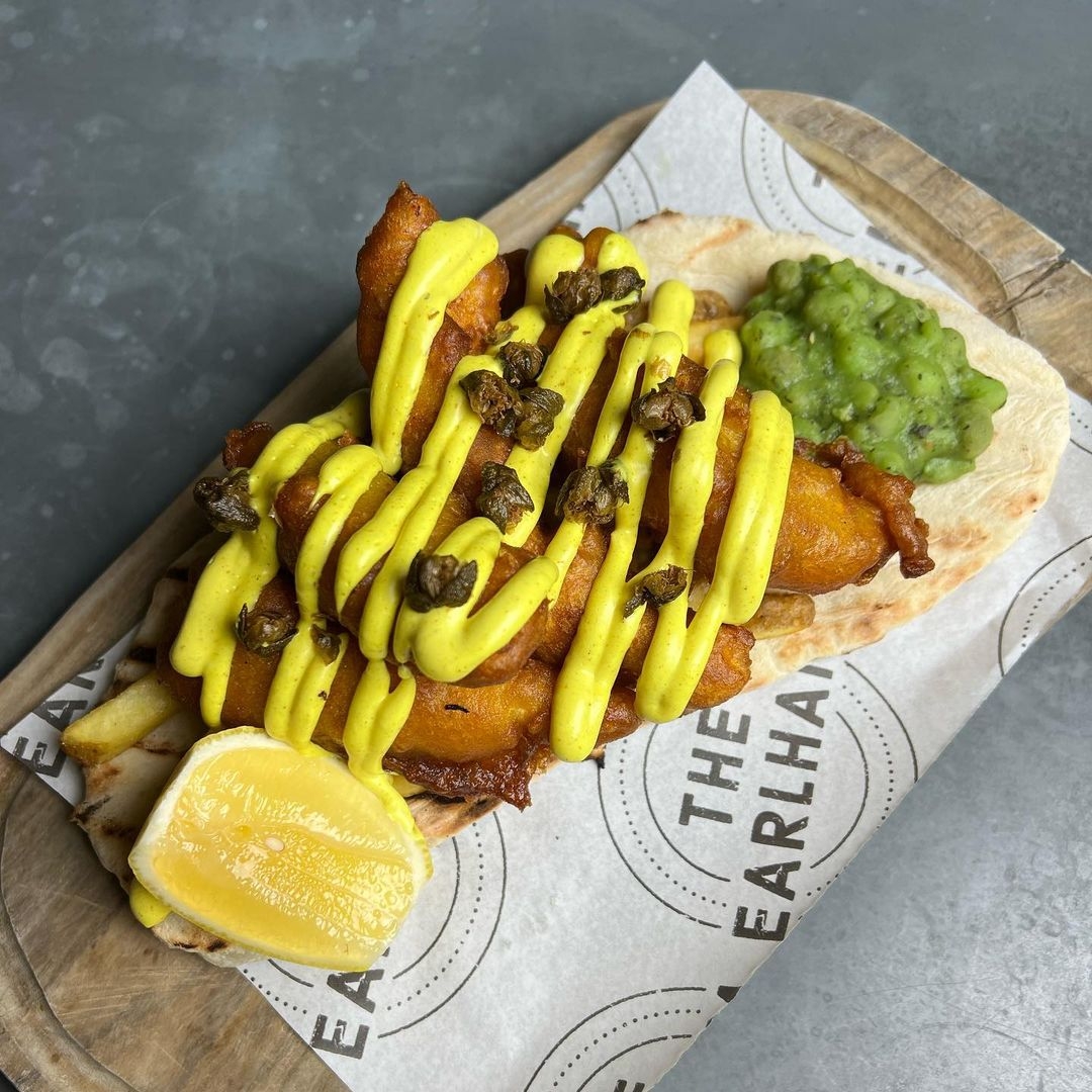 Chip shop curry mayo, malt vinegar battered fish, skin on fries, fried capers & mint mushy peas