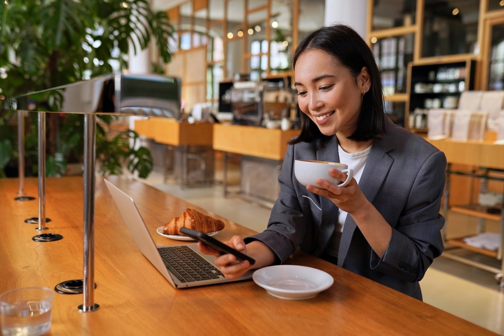 business woman in a cafe working and having lunch