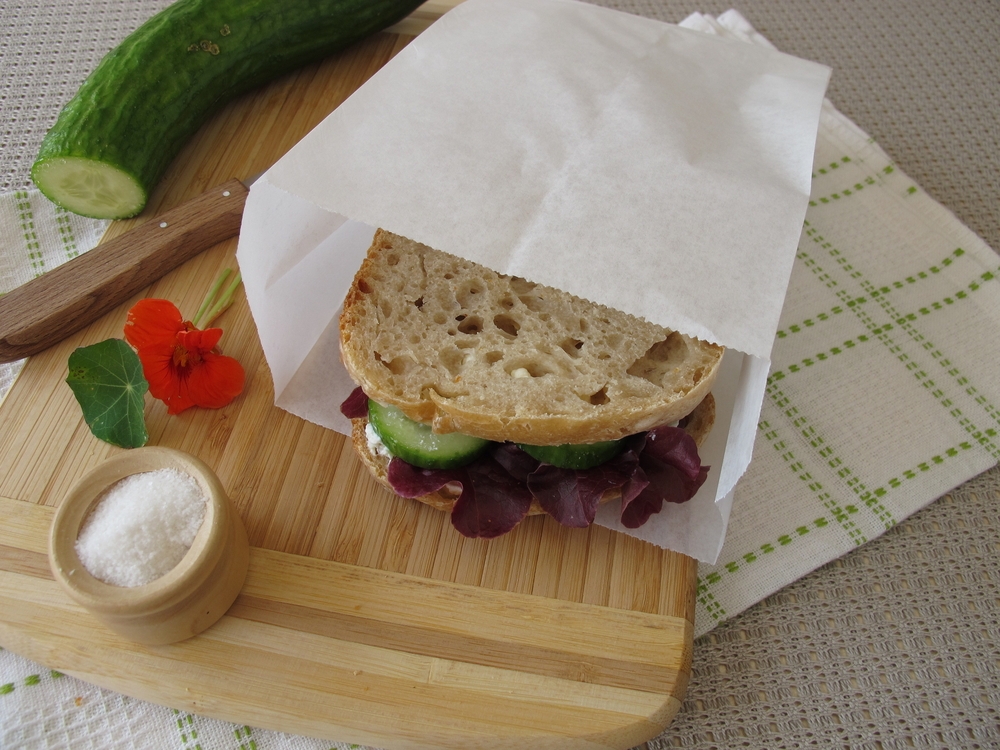 cucumber and sandwich in greaseproof paper bag