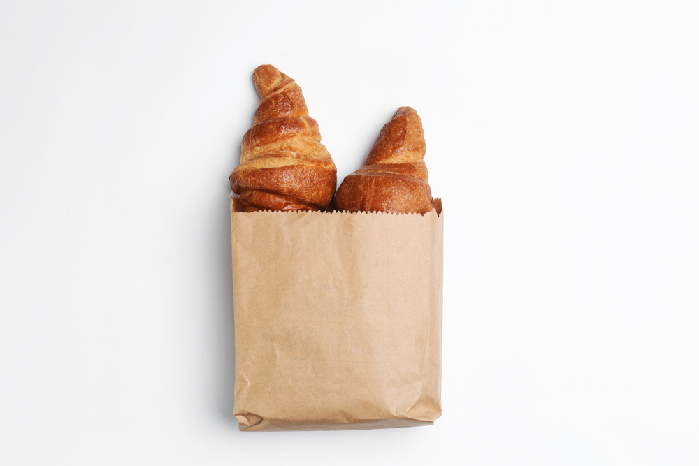 eco-friendly paper bag containing croissants
